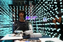 Artist robot Ai-Da paints at 2024 AI For Good Global Summit, Switzerland, May 30, 2024. (Photo: Xinhua/VNA)