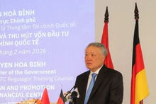 Permanent Deputy Prime Minister Nguyen Hoa Binh, Chairman of the Executive Board of the Viet Nam International Financial Centre, delivers opening remarks at the ceremony. (Photo: VNA)