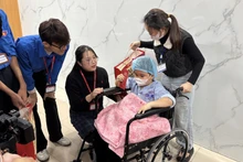 Gifts presented to a child patient ahead of Lunar New Year Festival (Tet)