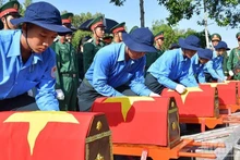 At a ceremony repatriating remains of fallen soldiers from Cambodia. (Photo: CHI PHUC)