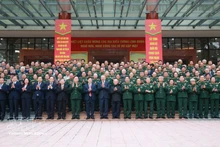 Party General Secretary To Lam (ninth, left, front row) and delegates at the meeting pose for a group photo. (Photo: VNA)