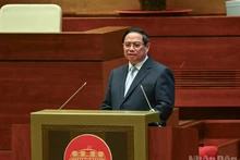 Prime Minister Pham Minh Chinh presents the action plan for implementing the Resolution of the 14th National Party Congress at the conference on February 7. (Photo: NDO)