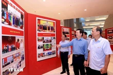 Deputy Prime Minister Mai Van Chinh (2nd from right) inspects preparations for the exhibitions on October 11. (Photo: VNA)