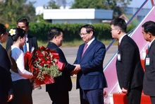 Prime Minister Pham Minh Chinh arrives in Vientiane on December 2 morning. (Photo: VNA)
