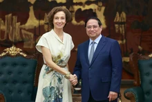 Prime Minister Pham Minh Chinh (R) receives Director-General of the United Nations Educational, Scientific and Cultural Organisation (UNESCO) Audrey Azoulay in Ha Noi on June 28 (Photo: VNA)