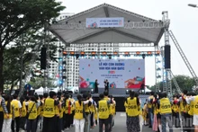 Young participants enjoy traditional Korean games in front of the main stage.