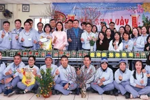 Workers at TOTO Viet Nam Company participate in the Tet celebration organised by the company’s Trade Union. (Photo: NGOC ANH)