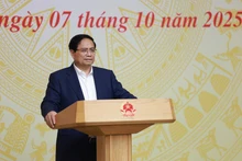 Prime Minister Pham Minh Chinh presides over the 16th session of the National Steering Committee on combating IUU fishing on October 7. (Photo: VNA)