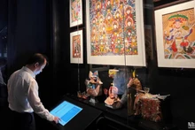 A visitor explores works on display at the space
