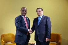 Prime Minister Pham Minh Chinh (R) and Prime Minister of the Solomon Islands Jeremiah Manele on the sidelines of the third United Nations Ocean Conference (UNOC 3) in Nice, France on June 9 (local time) (Photo: VGP)