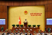 The draft law amending and supplementing a number of articles of the Law on Standards and Technical Regulations is approved with 432 out of 448 participating deputies voting in favour (Photo: VNA)