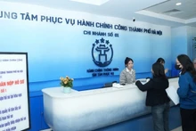 Citizens carry out administrative procedures at Ha Noi Public Administrative Service Centre.