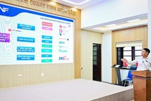 A representative of Electricity Finance Joint Stock Company shares the enterprise’s contributions to the National financial inclusion strategy. (Photo: Bao Long)