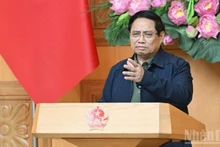 Prime Minister Pham Minh Chinh speaks at an emergency meeting on measures to address the aftermath of historic floods in central Viet Nam. (Photo: Tran Hai)