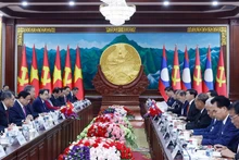 At the talks between General Secretary of the Communist Party of Viet Nam Central Committee To Lam and General Secretary of the Lao People’s Revolutionary Party Central Committee and President of Laos Thongloun Sisoulith. (Photo: VNA)
