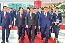Permanent member of the Secretariat Tran Cam Tu and delegates attend the inauguration ceremony of the Press Centre and chair an international press conference on the 14th National Party Congress.