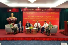 Delegates participate in a panel discussion at the symposium.