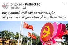 An article on the 14th National Congress of the Communist Party of Viet Nam published by the Lao News Agency (Photo: VNA)
