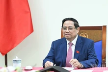 Prime Minister Pham Minh Chinh during phone talks with Alexey Likhachev, Director General of Russia’s State Atomic Energy Corporation (Rosatom). (Photo: NDO)