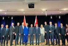 Delegates attend the forum.