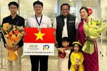 Tran Thuan Hieu (second from left) earns a silver medal at the 2026 International Artificial Intelligence Olympiad (IAIO).