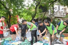 Tagom members instruct locals how to distinguish between organic and inorganic waste
