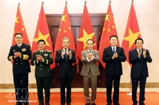 The Vietnamese and Chinese ministers of foreign affairs, national defence and public security pose for a photo at the first ministerial-level “3+3” strategic dialogue in Ha Noi on March 16. (Photo: VNA)