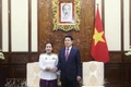 State President Luong Cuong (R) receives Cambodian Ambassador to Viet Nam Touch Pharat in Ha Noi on March 18. (Photo: VNA)
