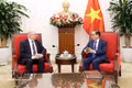 Minister of Foreign Affairs Le Hoai Trung (R) and Swedish State Secretary for Foreign Affairs Dag Hartelius in Hanoi on May 19, 2026. (Photo: VNA)