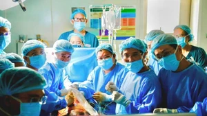 Doctors and nurses in the fetal heart intervention for a Singaporean pregnant woman.