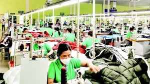 Production of textiles and garments for export at Nam Dinh Textile and Garment Joint Stock Corporation.