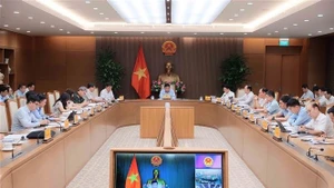 Deputy Prime Minister Nguyen Chi Dung chairs the first meeting of the inter-agency task force for coordinating smart city construction and development in Hanoi on July 16. (Photo: VNA)