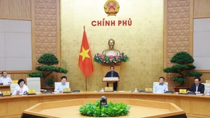 At the Government meeting on the implementation of the two-tier local government model in Hanoi on October 29 (Photo: VNA)