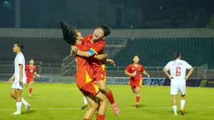 Vietnamese players celebrate a goal at the match against Myanmar on June 9 (Photo: VNA)
