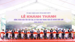 Prime Minister Pham Minh Chinh and delegates cut the ribbon to inaugurate the project to preserve and restore the Him Lam resistance centre relic site (Phase 2). (Photo: VNA)
