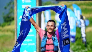 Ngo Van Chinh of the Sa Pa Ethnic Running Club finishes first with an impressive time of 13:00:10, setting a new course record for the race (Photo: VNA)