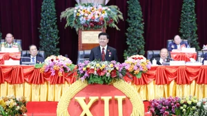 General Secretary of the Lao People's Revolutionary Party Central Committee Thongloun Sisoulith delivers a closing speech at the 12th National Congress of the Lao People's Revolutionary Party. (Photo: VNA)