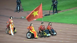 The Vietnamese Paralympic team parades at the closing ceremony of the Games.