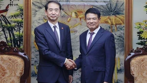 Supreme People’s Procuratorate Chief Prosecutor Nguyen Huy Tien and He Wei, Ambassador Extraordinary and Plenipotentiary of the People’s Republic of China to Viet Nam.