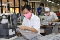 Workers at Protrade Garment Joint Stock Company in Binh Duong Province.