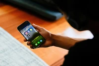 A high school student poses with his mobile phone showing his social media applications in Melbourne, Australia, November 28, 2024. (Photo: REUTERS)