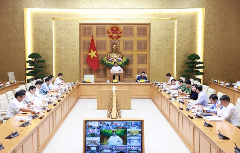 Prime Minister Pham Minh Chinh chairs a teleconference to review recovery efforts following the devastating impact of Typhoon Bualoi, and to prepare for the arrival of Typhoon Matmo. (Photo: VNA)