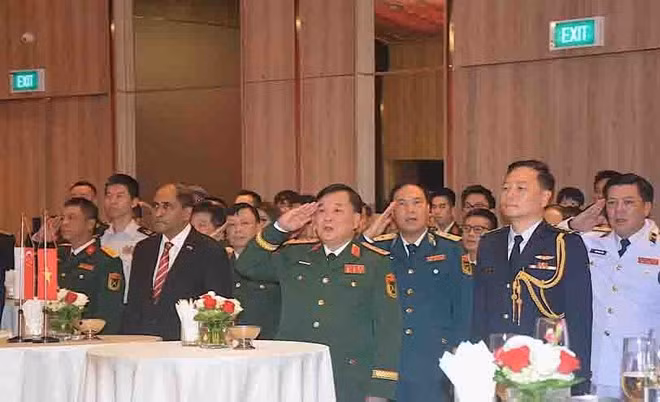 Senior Lieutenant General Hoang Xuan Chien and delegates from other countries attend the event. (Photo: qdnd.vn)