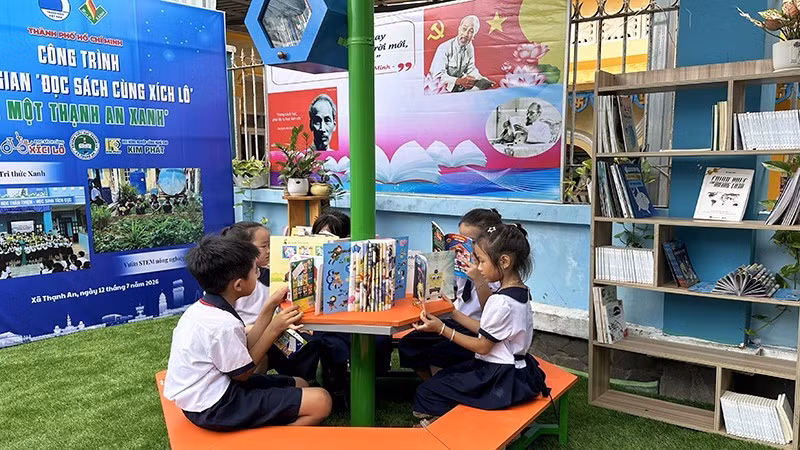 Children read books at the newly inaugurated “Green Library.”