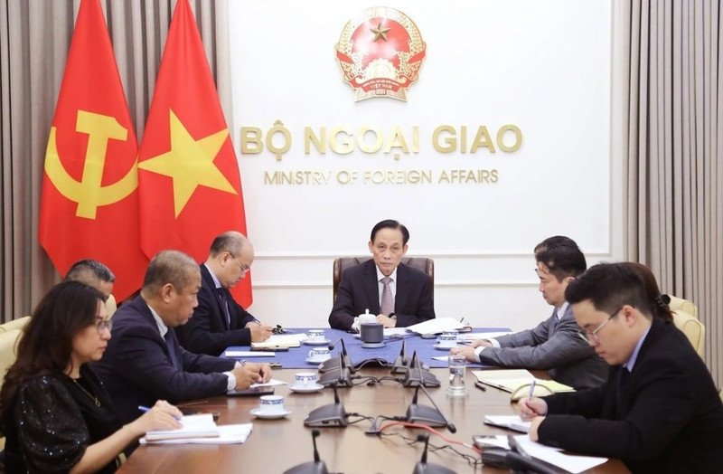 Politburo member and Minister of Foreign Affairs Le Hoai Trung at the phone talks (Photo: VNA)