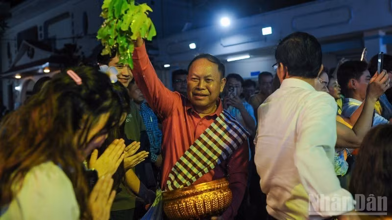 The Buddha bathing ritual, through which participants exchange wishes for peace and good fortune in the New Year.
