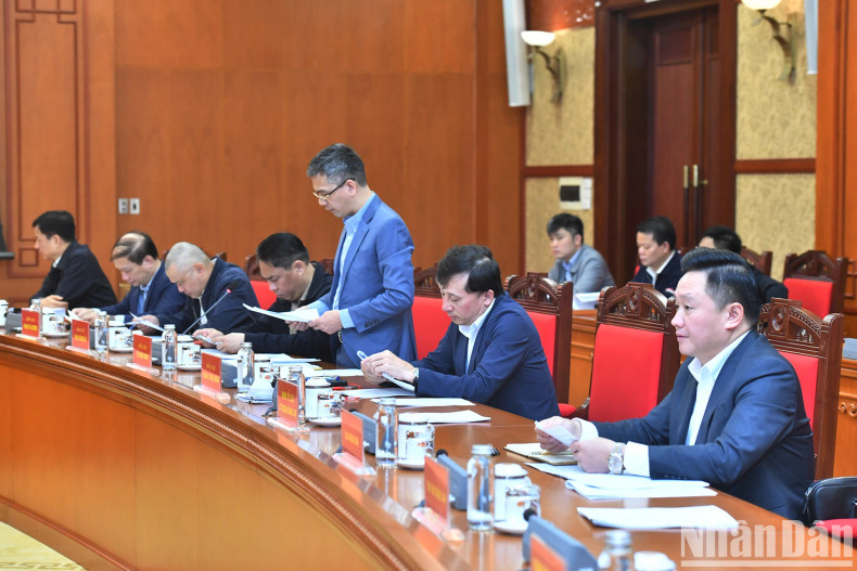 Delegates attend the meeting.