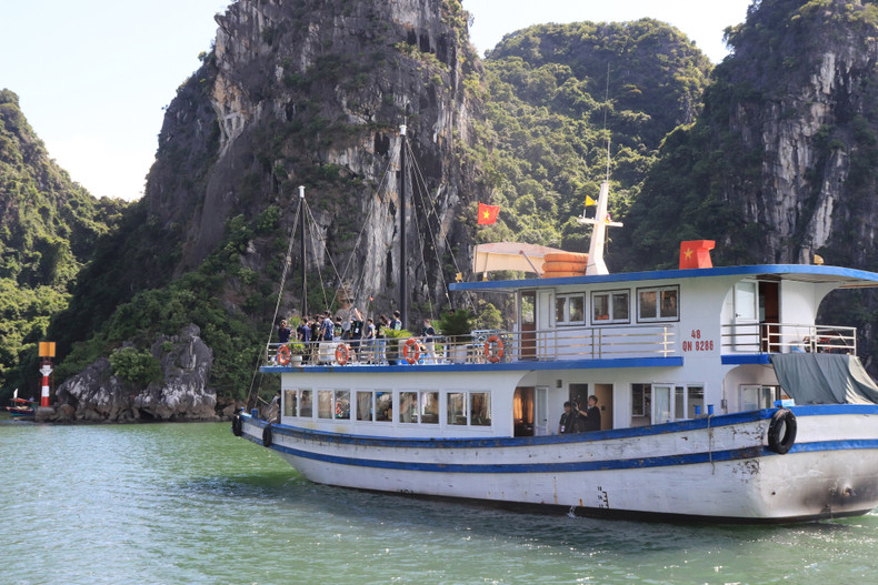 Tourists visit Ha Long Bay.