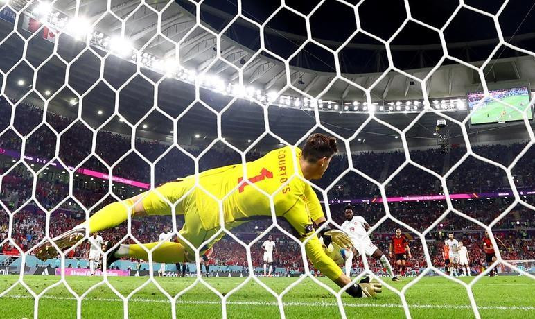 Canada's Alphonso Davies has his penalty saved by Belgium's Thibaut Courtois. (Photo: Reuters)