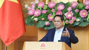Prime Minister Pham Minh Chinh speaks at the meeting on the implementation of the national achievements exhibition marking the 80th anniversary of National Day. (Photo: NDO)